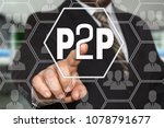 Peer to peer. P2P on the touch screen with a blur background of the businessman with the phone.The concept of Peer to peer, P2P