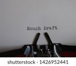 Small photo of words "rough draft" typed on a typewriter