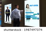 Small photo of smart retail concept customer use voice command technology combined chatbot on smart digital signage to find the satisfaction suitable suit by use artificial intelligence with augmented mixed virtual
