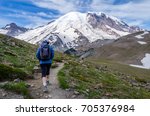 Hikers on Burroughs Mountain trail, Mount Rainier National Park, heading towards third Burroughs Mountain