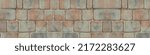 Small photo of High quality designs for Kitchen splashbacks. Design for Glass print, Old coarse panoramic stone wall made of various square natural stones in beige, ocher and brown