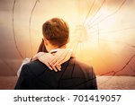 Lovers back hugging over dramatic sunset sky background.Sad young couple in relationship difficulties. Broken heart or divorce concept, double exposure. Break off, withdraw, disengage one's engagement