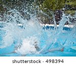 This is a stop action shot of a big splash in a pool.