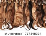 Hair extension equipment of natural hair. Hair samples of different colors