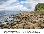 A Wide Rocky Beach With Large...