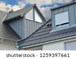 Grey Tiled Roof and standing Seam Metal plated Fume Hoods, Eves Gutter, Rain Pipe and Metal plated Chimneys