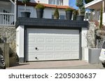 Modern Car Garage with automatic Door in Front of a residential Building