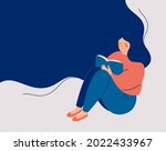 happy woman sits and reads the... | Shutterstock .eps vector #2022433967