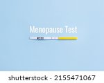Small photo of Inscription Menopause test and home express-test FSH on blue background. Replacement hormone therapy concept. Copy space