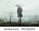 Woman With Umbrella Standing On ...