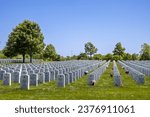 Small photo of Minneapolis, Minnesota, USA - May 27, 2023: Landscape view of soldier gravestones at Fort Snelling National Cemetery on a clear day.