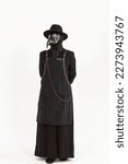 Small photo of Full-length portrait of a plague doctor from Medieval era. high-quality, detailed costume with a hat, leather mask, apron, and long coat. Isolated on a white background. epidemic and pandemic concept.
