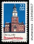Small photo of SINGAPORE – MARCH 11, 2022: A stamp printed in USA shows old Building, Pennsylvania, Ratification of the Constitution series, circa 1987