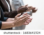 Hands of business colleagues applauding speaker. Business group appreciating presentation, seminar, training or conference. Applause or success concept