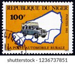 Small photo of ZAGREB, CROATIA - NOVEMBER 3, 2018: a stamp printed in Niger shows Mail Van and Map of Niger, circa 1983