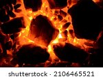 A bright contrasting background consists of burning anthracite coal of different fractions.