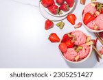 Small photo of Rhubarb and strawberry ice cream, homemade sorbet gelato, frozen fruity dessert with fresh rhubarb and strawberry slices, on white kitchen table copy space