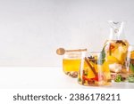 Small photo of Fire cider, hot drink with apple cider vinegar, spices, herb and citrus slices. Organic raw natural flu and cold remedy drink, immune support, anti-inflammatory recipe
