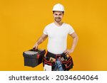 Young smiling excited confident employee handyman man 20s in protective helmet hardhat tool case box isolated on yellow background Instruments accessories renovation apartment room Repair home concept