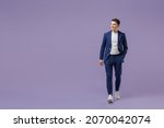 Small photo of Full size fun young successful employee business man lawyer 20s wears formal blue suit white t-shirt work in office move hand in pocket look aside isolated on pastel purple background studio portrait