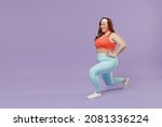 Small photo of Full length side view happy young chubby overweight plus size big fat fit woman in red top warm up train squating lunges with legs isolated on purple background gym. Workout sport motivation concept