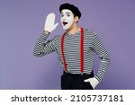 Young mime man with white face mask wears striped shirt beret scream hot news about sales discount with hands near mouth look camera isolated on plain pastel light violet background studio portrait