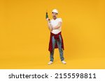Full length young happy employee handyman man in protective helmet hardhat glasses use electric drill isolated on yellow background Instruments accessory renovation apartment room Repair home concept