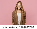 Small photo of Young satisfied smiling happy fun cheerful successful european employee business woman 30s she wearing casual classic jacket look camera isolated on plain pastel light pink background studio portrait