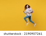 Small photo of Full body young black teen girl student she wear casual clothes backpack bag jump high look camera run fast hurrying isolated on plain yellow color background. High school university college concept