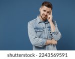Small photo of Sick ill aggrieved stressed young brunet man 20s wear denim jacket put hands on head rub temples having headache suffering from migraine feel bad seedy isolated on dark blue background studio portrait