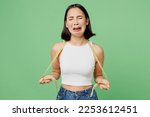 Small photo of Young unhappy sad woman wearing white clothes hold measuring tape on neck crying isolated on plain pastel light green background. Proper nutrition healthy lifestyle fast food unhealthy choice concept