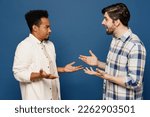 Small photo of Side view young two friends shocked surprised men 20s wear white casual shirts talk speak together spread hands hear fake news isolated plain dark royal navy blue background. People lifestyle concept