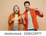 Small photo of Young excited surprised shocked couple two friends family man woman wear casual clothes point finger on himself show thumb up together isolated on pastel plain beige color background studio portrait