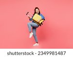 Small photo of Traveler woman wears blue shirt casual clothes hold suitcase pov play guitar isolated on plain pink background. Tourist travel abroad in free spare time rest getaway. Air flight trip journey concept