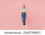 Small photo of Full body elderly blonde woman 50s years old she wearing blue undershirt casual clothes look camera hold hands crossed folded isolated on plain pastel light pink background studio. Lifestyle concept