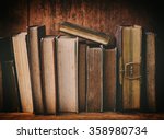 Old Books On Wooden Shelf.