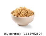 Brown rice in white cup...