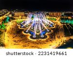 Aerial view to largest light and music fountain in Russia. 2214 colours jets burst into sky with musical accompaniment. Night show fire on the water in Nizami Ganjavi Park Derbent, Dagestan, Europe.