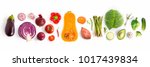 Creative layout made of green peas, cabbage, sweet potato, avocado, tomato, onion, beetroot, pepper, aubergine, artichoke, broccoli and cucumber on the white background.. Flat lay. Food concept. 