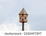 Birdhouse standing high. bird nest. birdhouse standing in the fields.