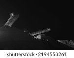 Small photo of Stopped conveyor belts at a crushing and screening plant, after the plant was closed due to the imposition of economic sanctions. Black and white night image in low light.