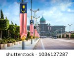 Small photo of View of the Prime Minister's office from the Seri Gemilang Bridge in the planned city of Putrajaya south of Kuala Lumpur with malaysian flags all along the road