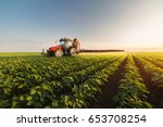 Tractor Spraying Pesticides On...