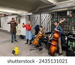 Small photo of New York City-Jan 11, 2023: Young musicians performing in the New York City subway are looking to gain recognition and perhaps earn a few dollars from passengers.