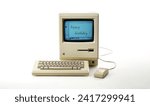Small photo of Aachen, Germany - March 14, 2014: Studioshot of an original Macintosh 128k called Apple Macintosh on white background. This was the first produced Mac, released on january 1984