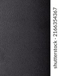 Small photo of Black embossed plastic texture. Shagreen background
