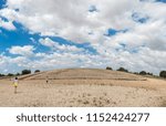 Small photo of Children getting close to Dolmen de Soto burial mound. This is the most importat megalithic monuments in the province of Huelva, Spain