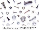 Set of old metal screw, bolt head, nut, washer and nail tool isolated on white background