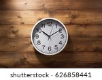 Wall Clock At Wooden Background ...
