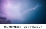 Small photo of A strong storm with bright lightning illuminating ominous clouds. Exotic image of the texture of storm clouds. Adverse weather conditions. Picturesque photo wallpaper. Climate change. Force of nature.